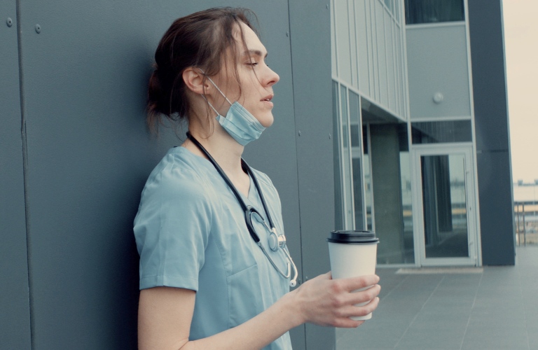 Stressed out nurse or doctor with a coffee_s